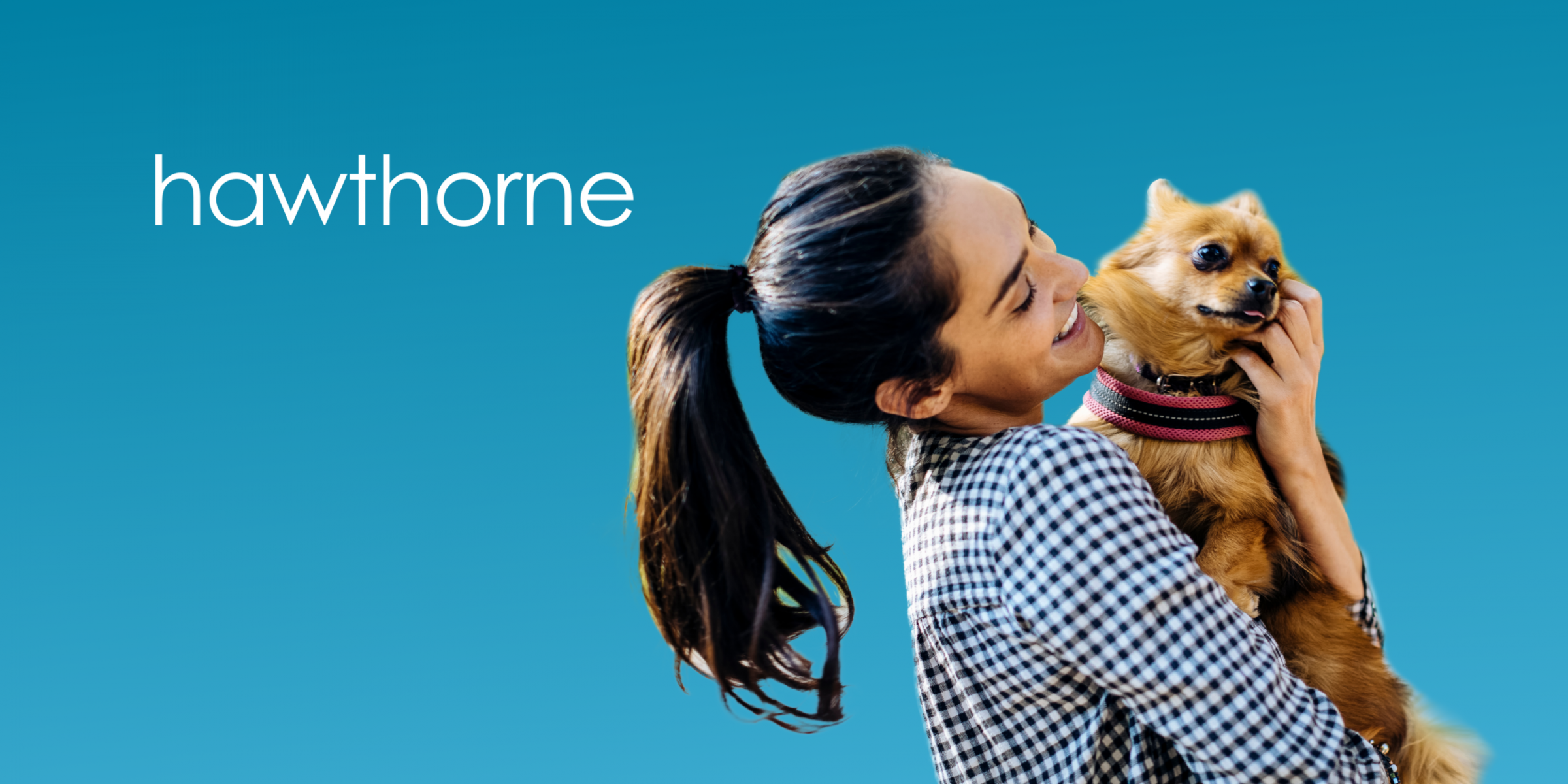 Woman smiling and holding a small dog, with "hawthorne" on a blue background—celebrating pet-friendly places in Asheville.